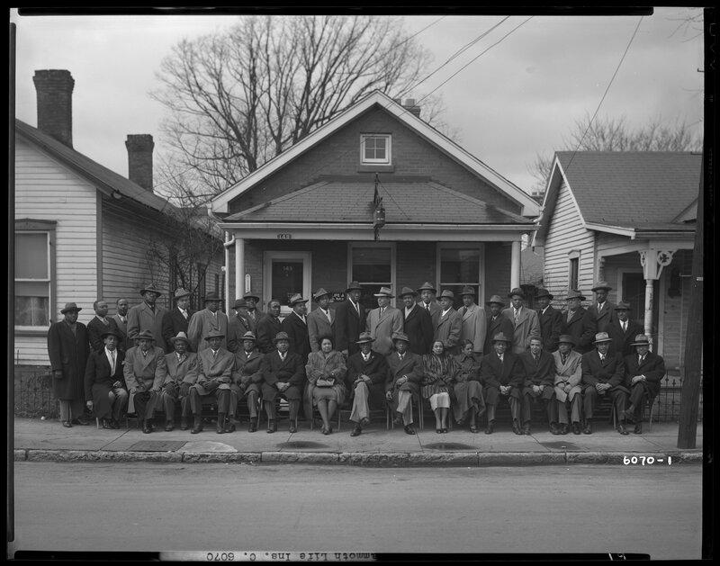 "Mammoth Life Insurance Company, 149 Deweese; exterior; group portrait of a large gathering of African-Americans"